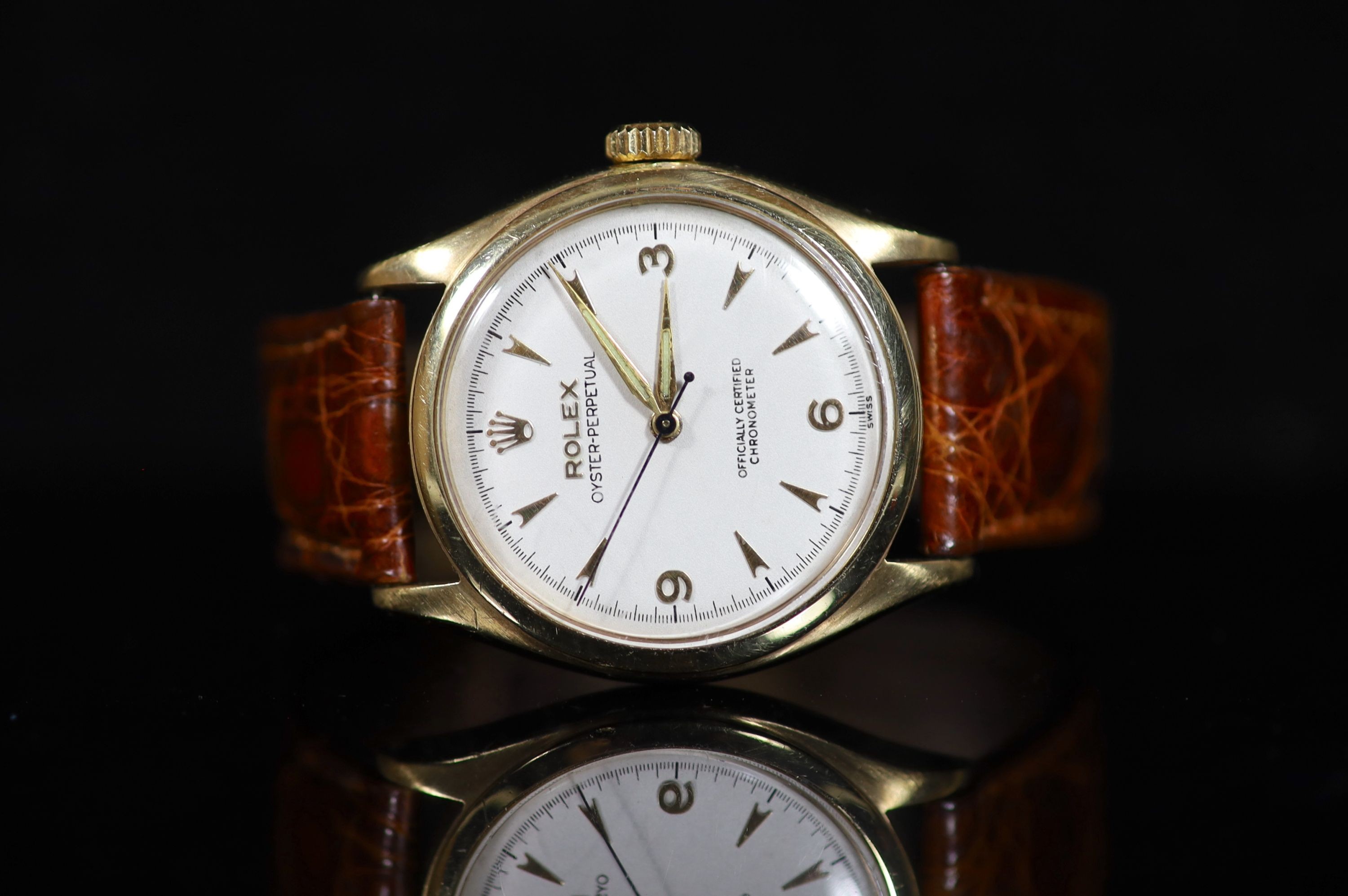 A gentleman's early 1950's 9ct gold Rolex Oyster Perpetual bubbleback wrist watch, on a leather strap with gold plated Rolex buckle